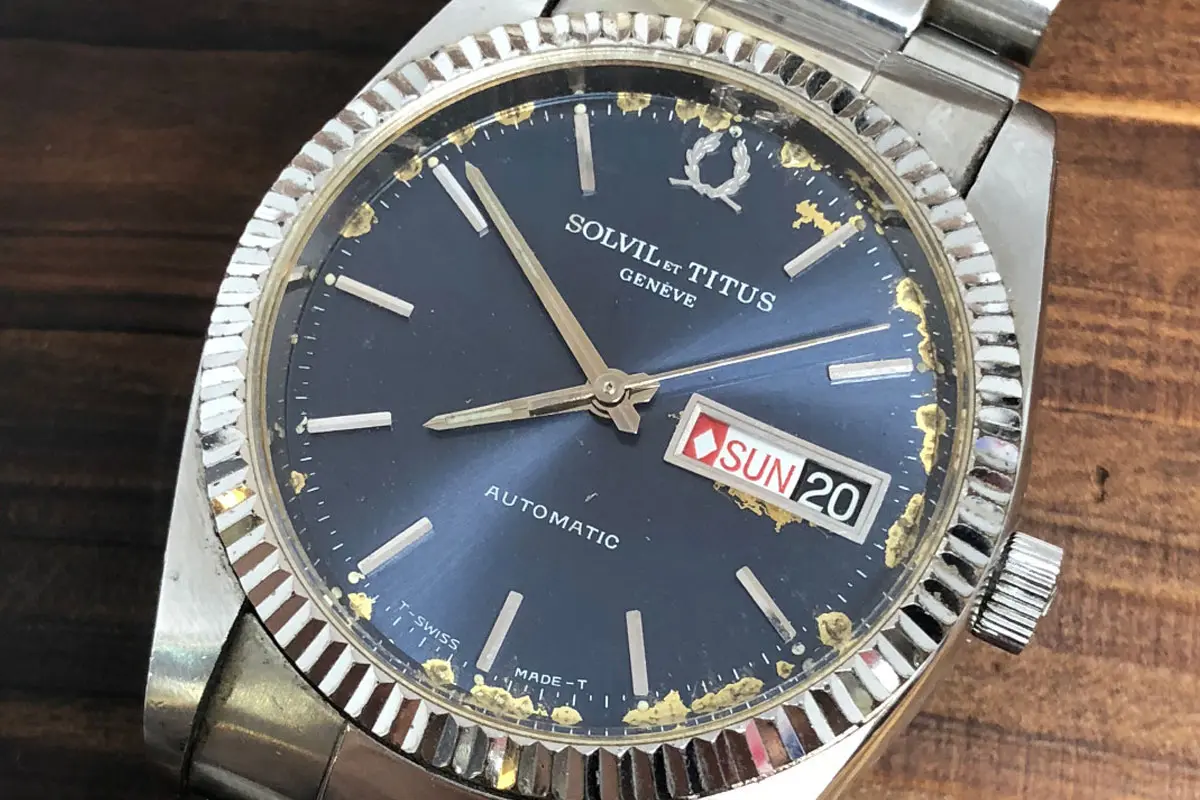 Solvil et Titus铁达时品牌LOGO设计案例-月桂环绕元素标志设计